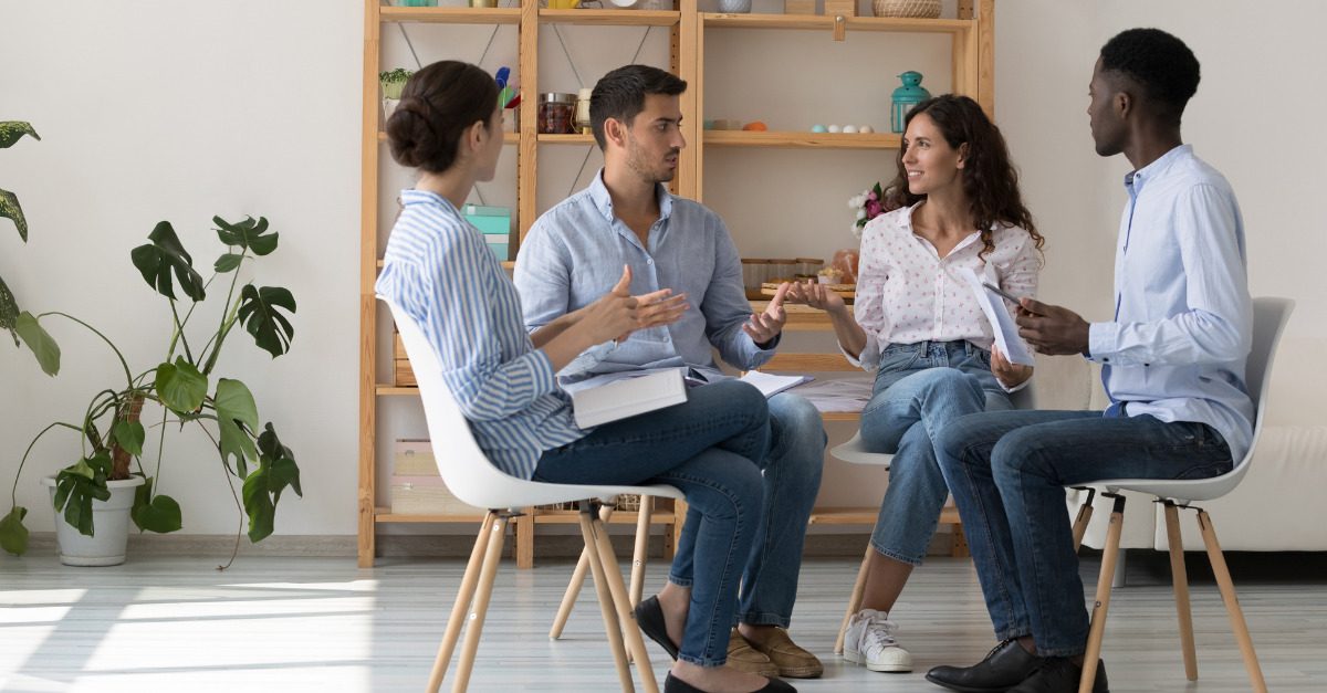 People sitting in a circle talking