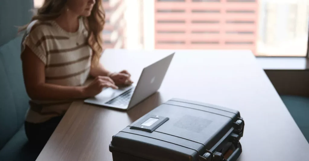 A woman works remotely on a laptop with ReadyTechGo