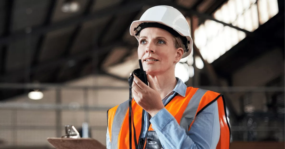 Supply chain professional with a walkie-talkie