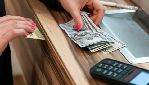 banker with money and a calculator banking