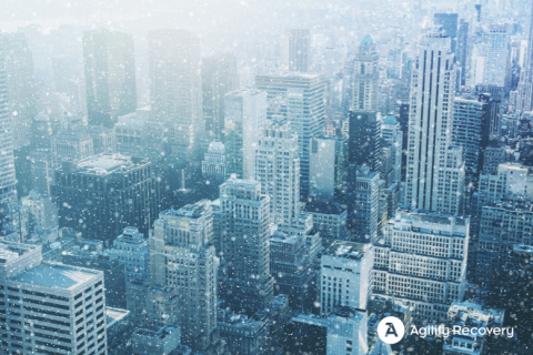winter snowstorm over a city