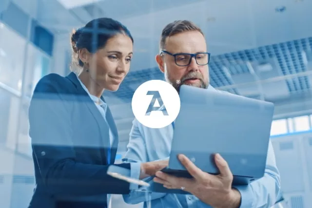 Two professionals looking at a tablet