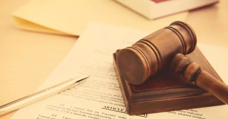 A gavel over legal paperwork