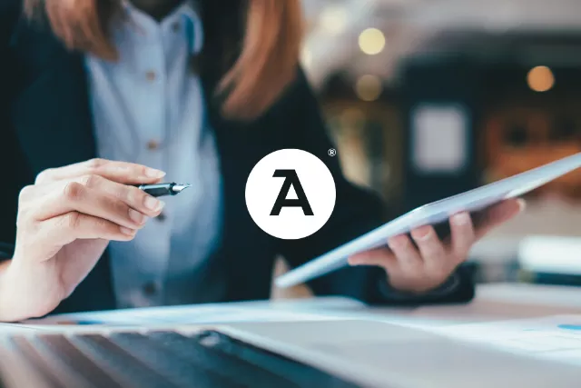 A business person with a notepad and pen