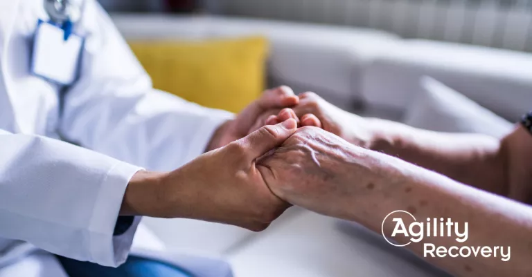Doctor and patient holding hands