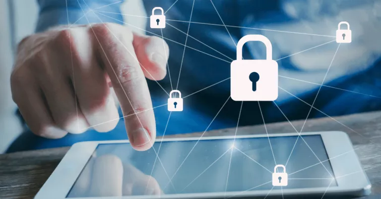 A person with a tablet with cybersecurity padlock icons overlaid
