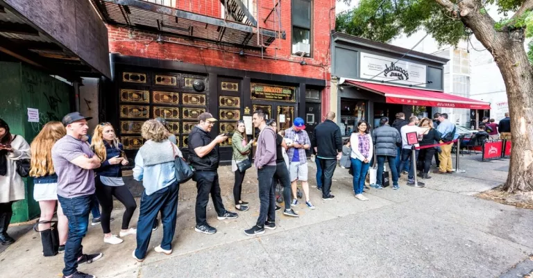 People standing outside in line