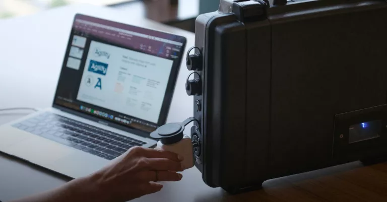 ReadyTechGo next to a laptop