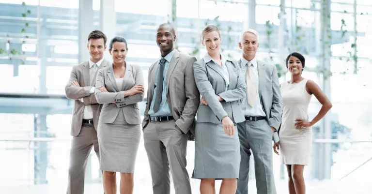 Smiling group of C-suite executives