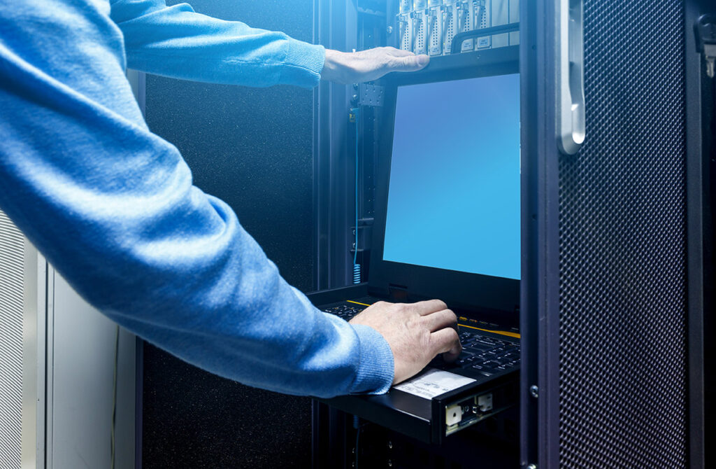 Close Up Hands Of Male Technician Working On Laptop And Checking