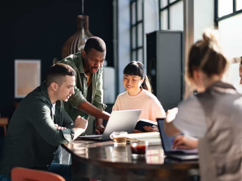 Diverse Team Working Together in Modern Co-Working Space