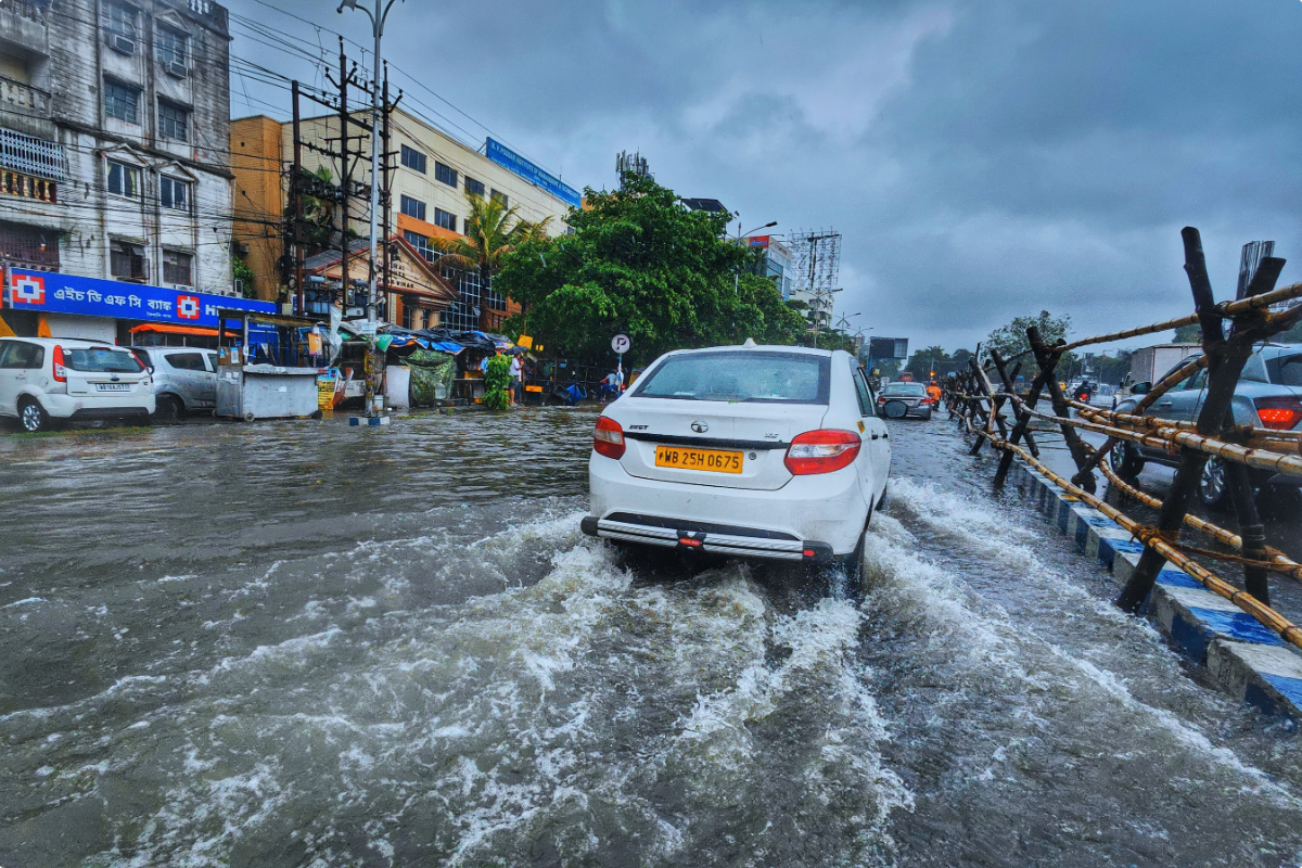 car driving through a flooded street
